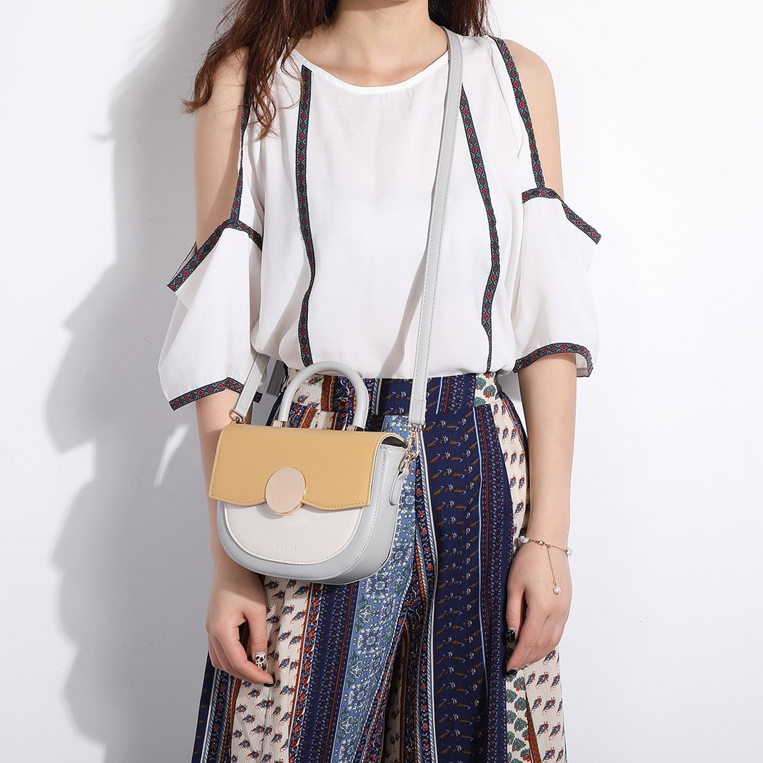Circular hardware flap colourblock PU leather crossbody bag