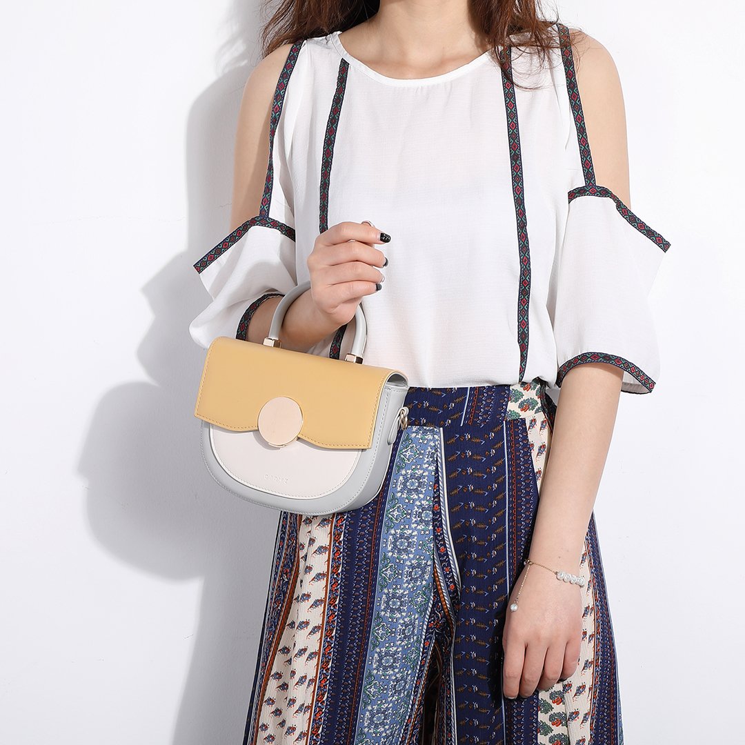 Circular hardware flap colourblock PU leather crossbody bag