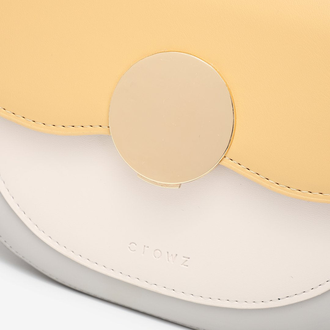 Circular hardware flap colourblock PU leather crossbody bag
