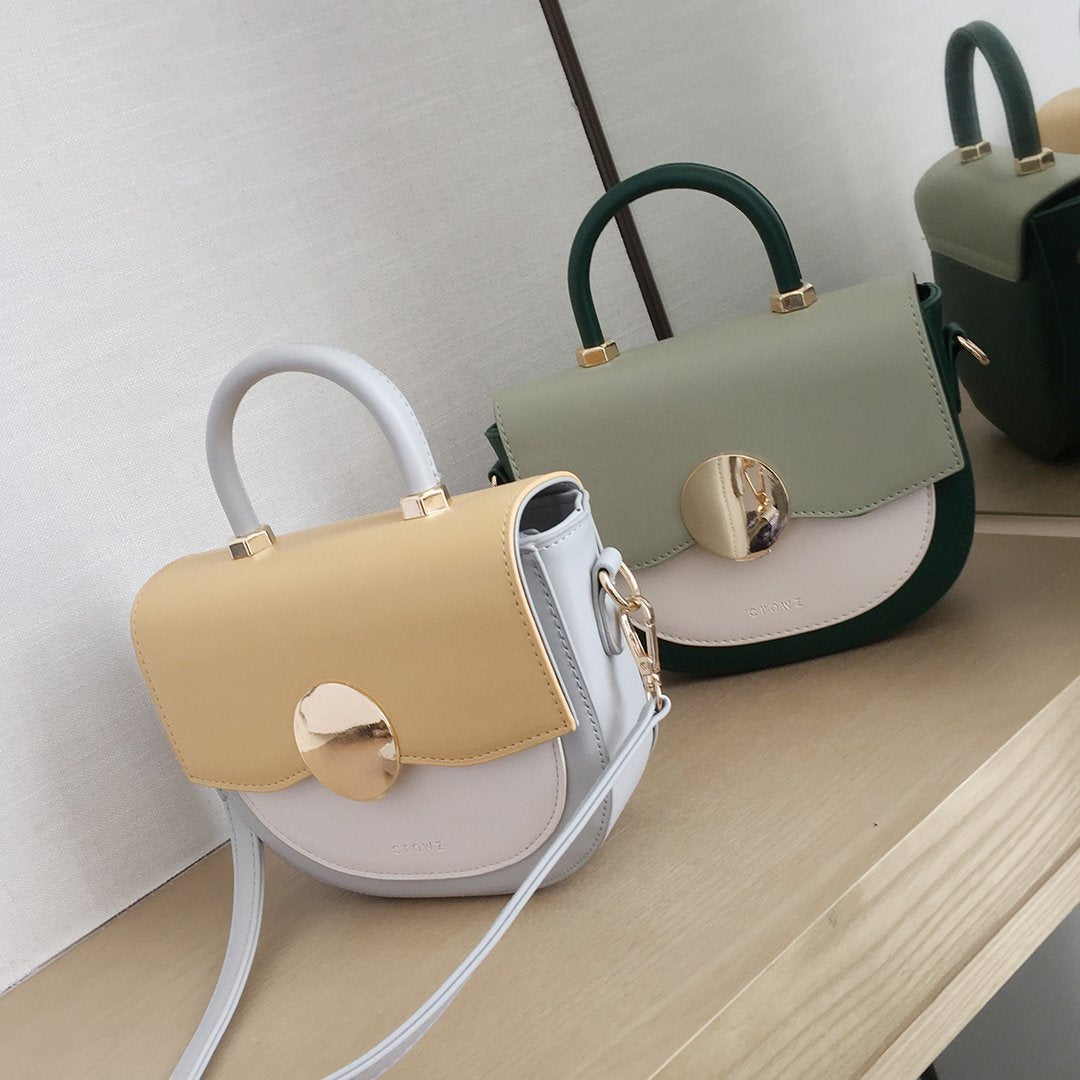 Circular hardware flap colourblock PU leather crossbody bag