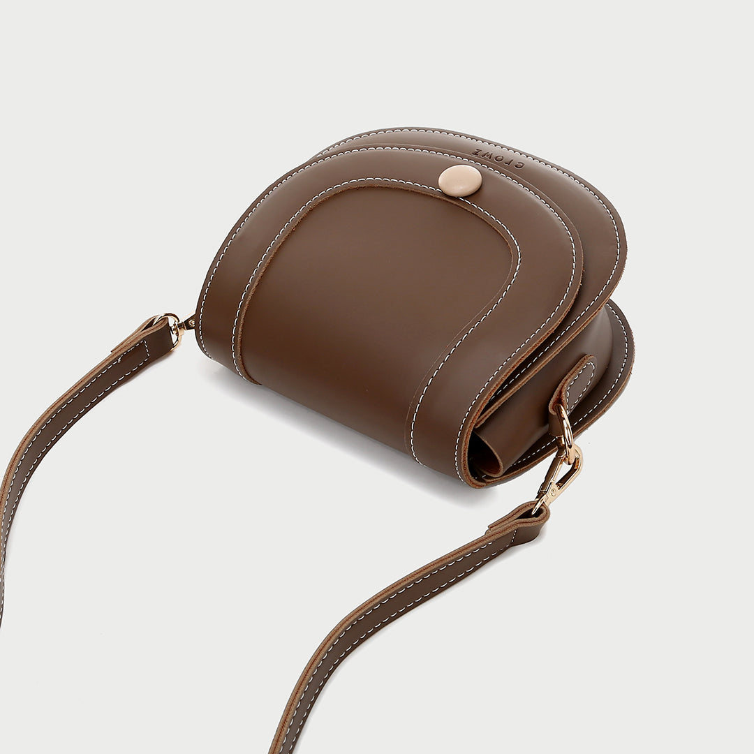 Contrast stud topstitched PU leather saddle bag