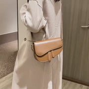 Retro strap detail flap sculptural PU leather saddle bag