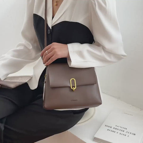 Oval hoop metallic closure dual compartment PU leather bag