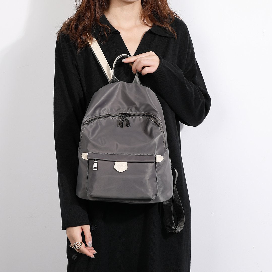 Logo stamped PU leather trim nylon backpack