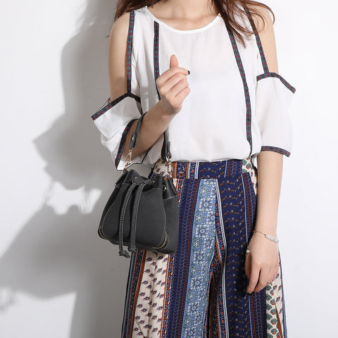 Zip detail drawstring dual compartment PU leather bucket bag