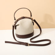 Retro snap-fastening cylindrical PU leather bucket bag