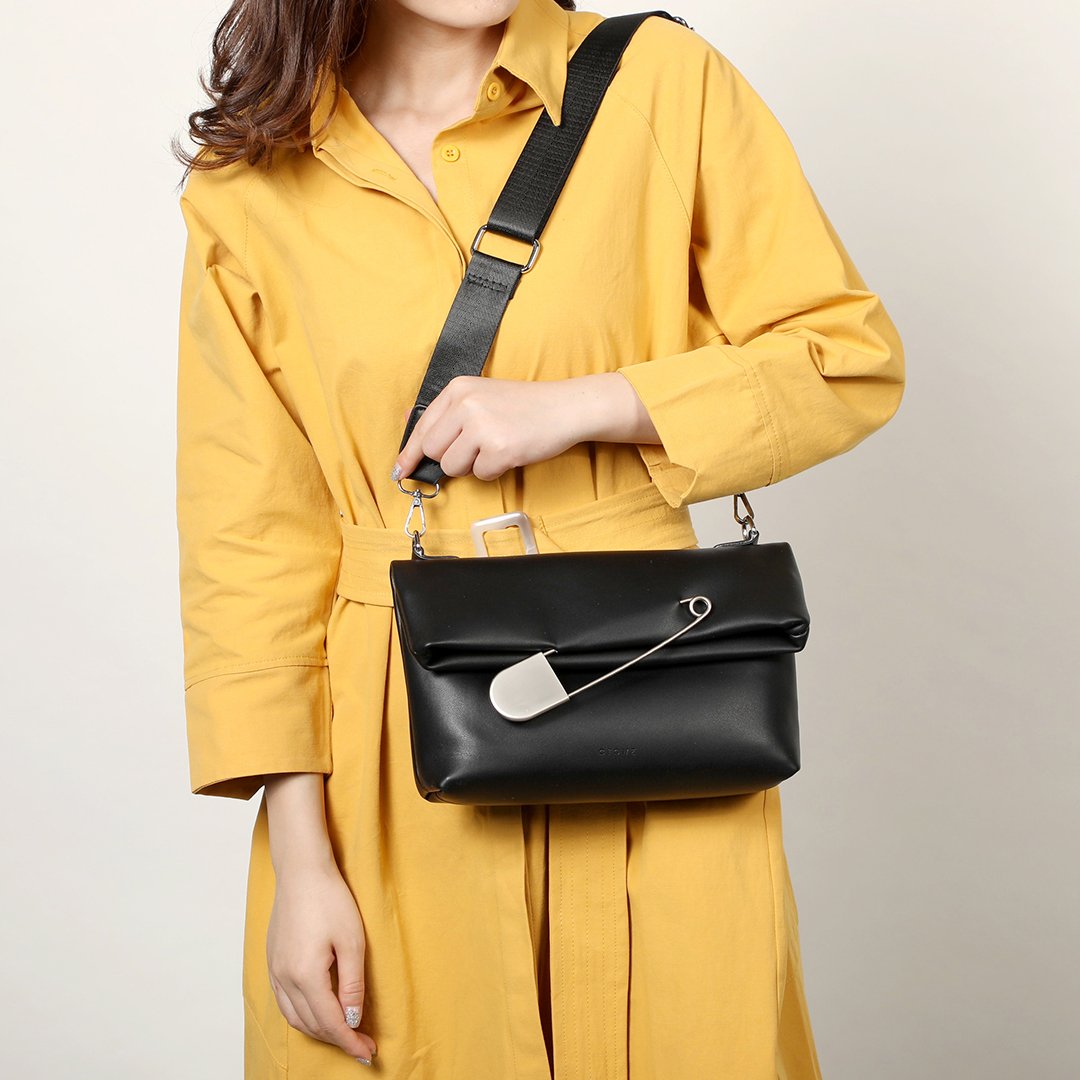 Safety pin embellished flap crossbody bag