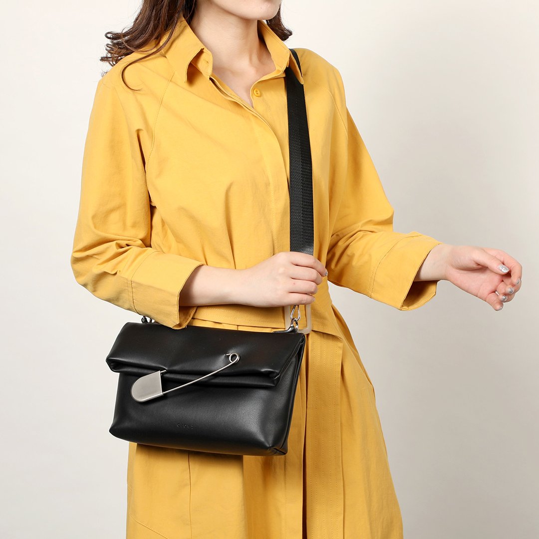Safety pin embellished flap crossbody bag
