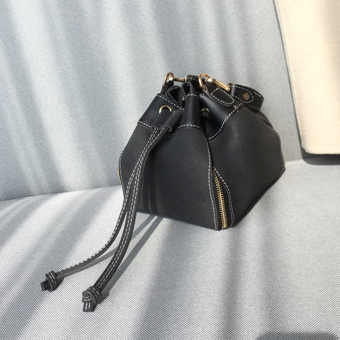Zip detail drawstring dual compartment PU leather bucket bag