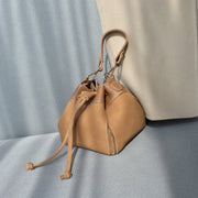 Zip detail drawstring dual compartment PU leather bucket bag