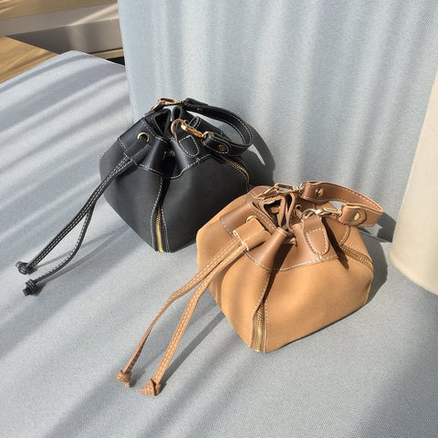 Zip detail drawstring dual compartment PU leather bucket bag