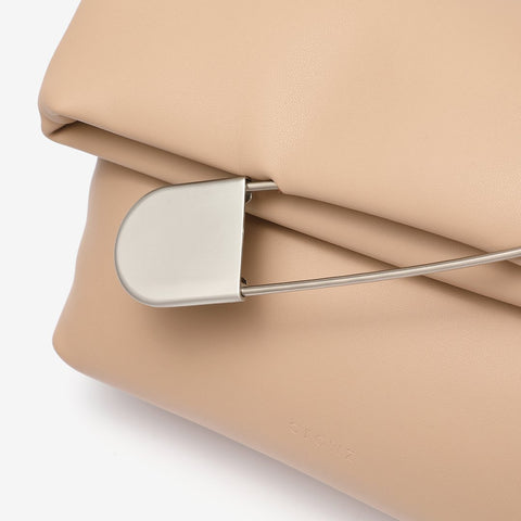 Safety pin embellished flap crossbody bag