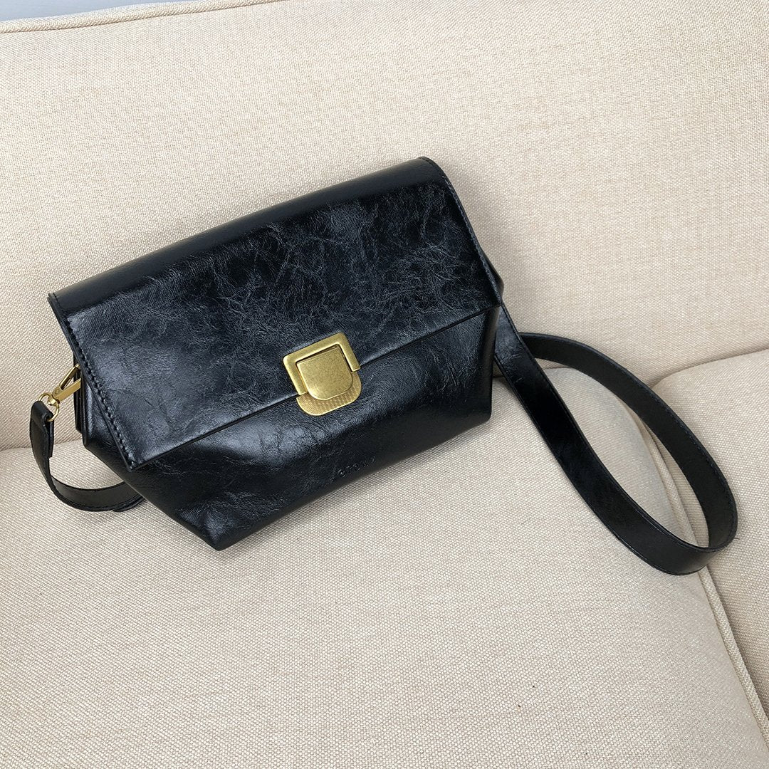 Metal lock hexagon creased PU leather crossbody bag