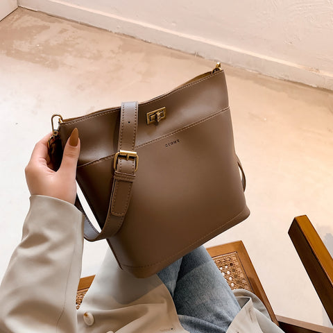 Minimalistic front pocket turn-lock PU leather bucket bag