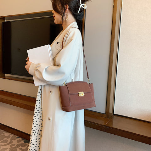 Modern metal-closure flap sculptural faux suede crossbody bag