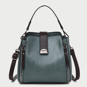 Half moon metal embellished strap zip side PU leather bucket bag