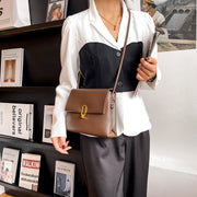 Oval hoop metallic closure dual compartment PU leather bag