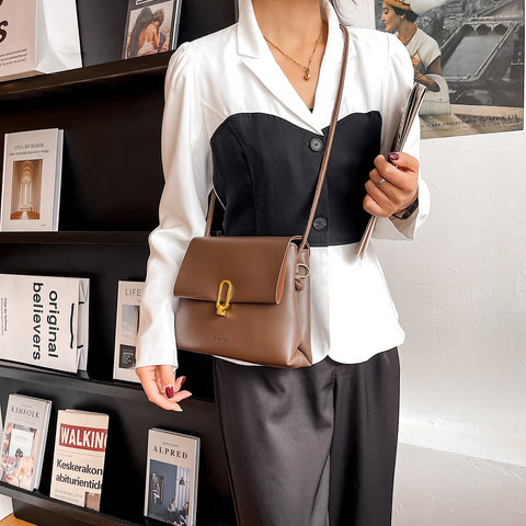 Oval hoop metallic closure dual compartment PU leather bag