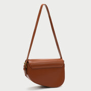 Retro strap detail flap sculptural PU leather saddle bag