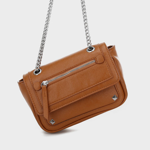 Zipped front flap studded PU leather crossbody bag