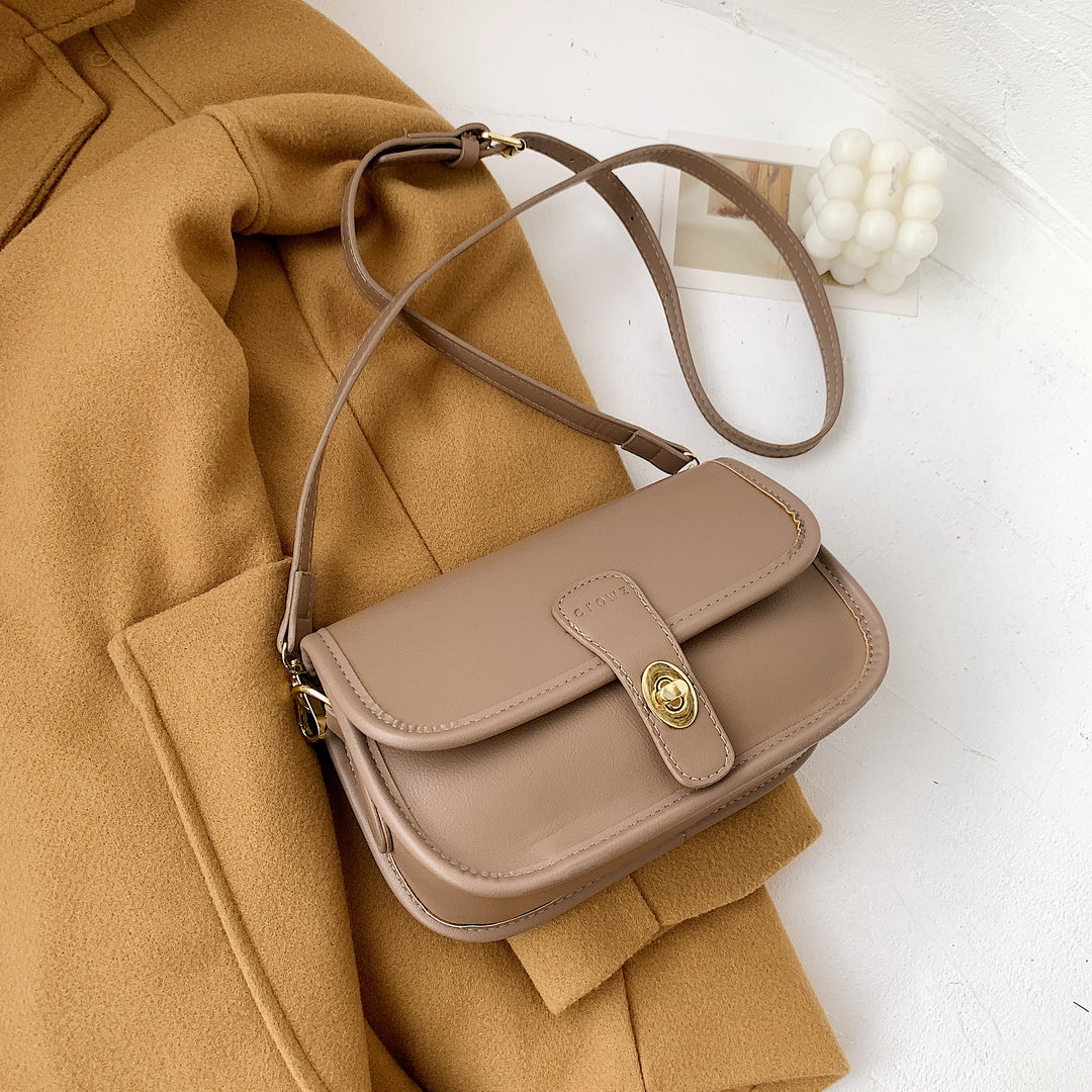 Metal turn-lock strap saddle style PU leather crossbody bag