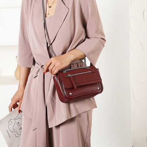 Zipped front flap studded PU leather crossbody bag