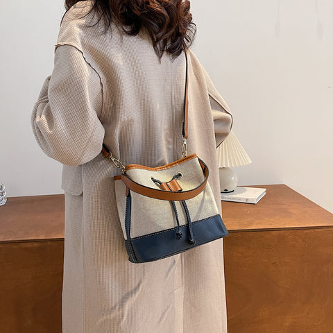 Modern drawstring detail colourblock PU leather canvas bucket bag