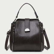 Half moon metal embellished strap zip side PU leather bucket bag