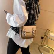 Double buckle strap flapover front pocket PU leather crossbody bag