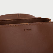 Oval metal clasp open-top flap PU leather crossbody bag