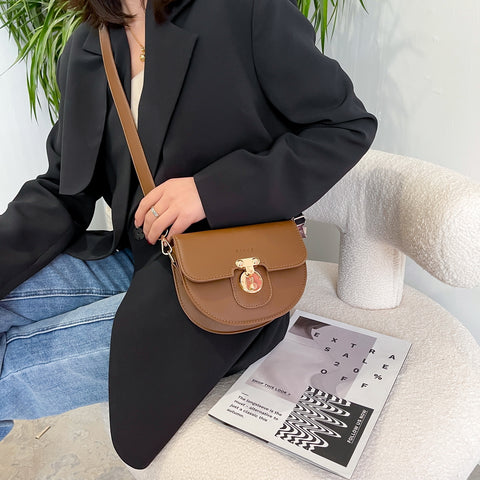 Elegant metal closure PU leather saddle crossbody bag