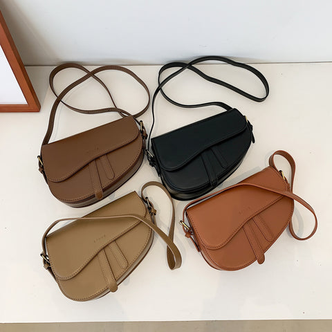 Retro strap detail flap sculptural PU leather saddle bag