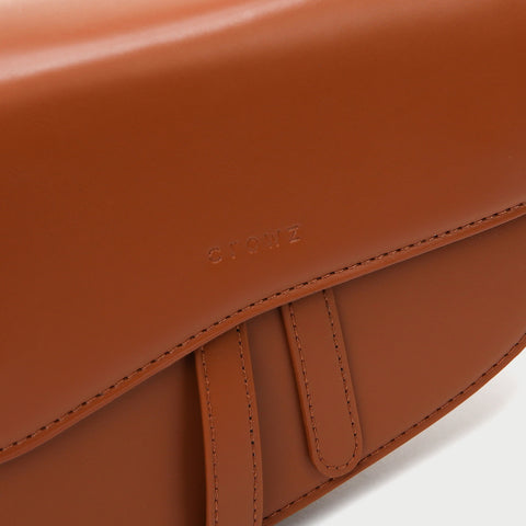 Retro strap detail flap sculptural PU leather saddle bag