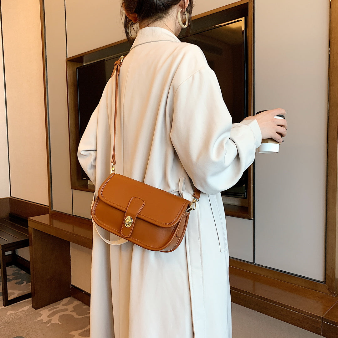 Metal turn-lock strap saddle style PU leather crossbody bag