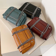 Zipped front flap studded PU leather crossbody bag