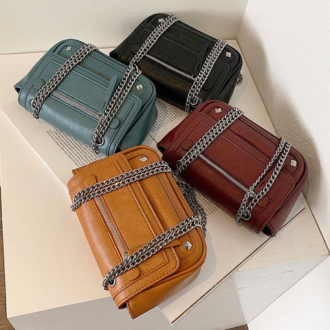Zipped front flap studded PU leather crossbody bag