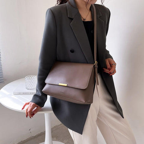 Metal hardware flap style PU leather crossbody bag