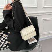 Flap style dual compartment quilted PU leather crossbody bag