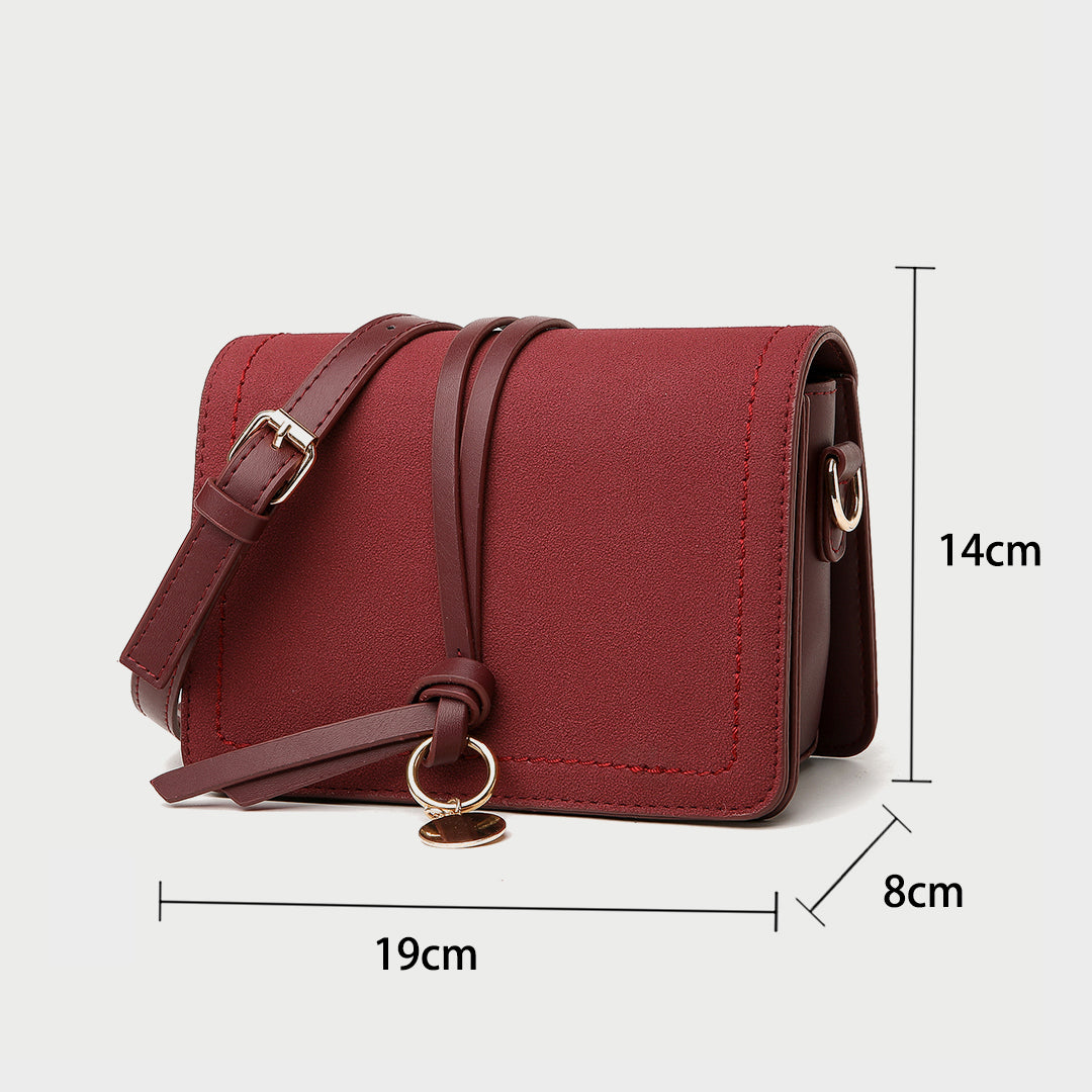 Knotted strap metal disc embellished PU leather crossbody bag