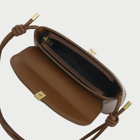 Metal clasp flap knotted strap PU leather shoulder bag