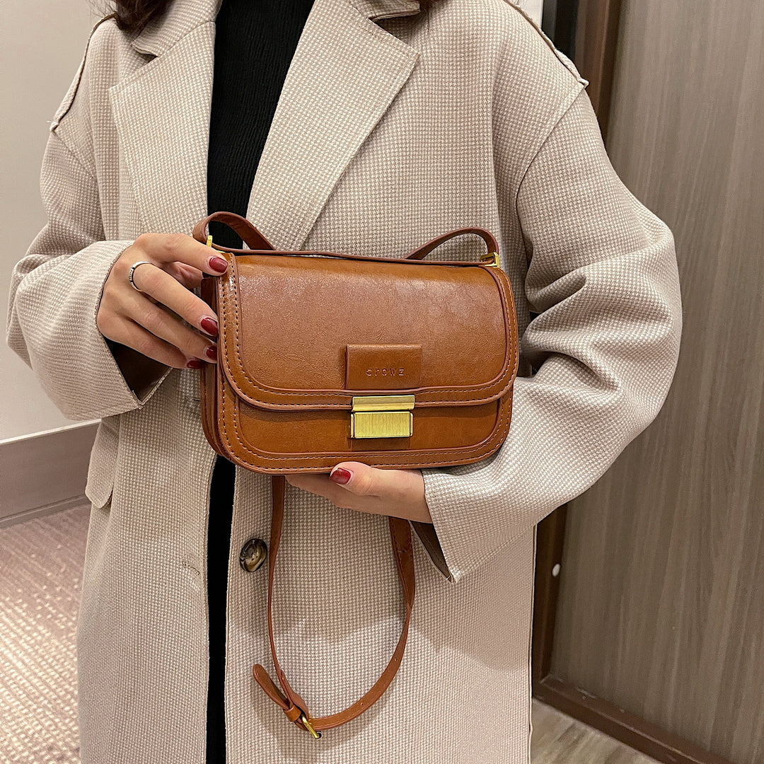 Metal clasp-lock flapover dual compartment PU leather crossbody bag