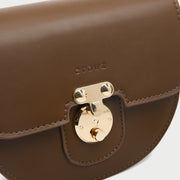 Elegant metal closure PU leather saddle crossbody bag