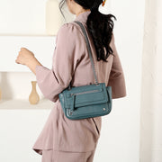 Zipped front flap studded PU leather crossbody bag