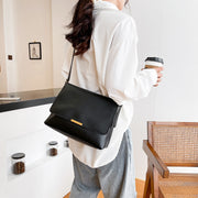 Metal hardware flap style PU leather crossbody bag