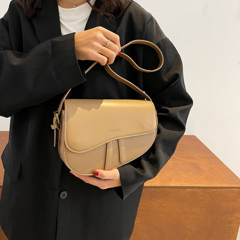 Retro strap detail flap sculptural PU leather saddle bag