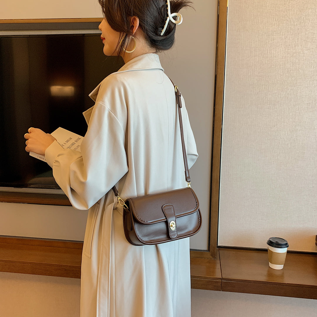 Metal turn-lock strap saddle style PU leather crossbody bag