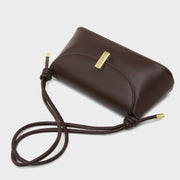Metal clasp flap knotted strap PU leather shoulder bag