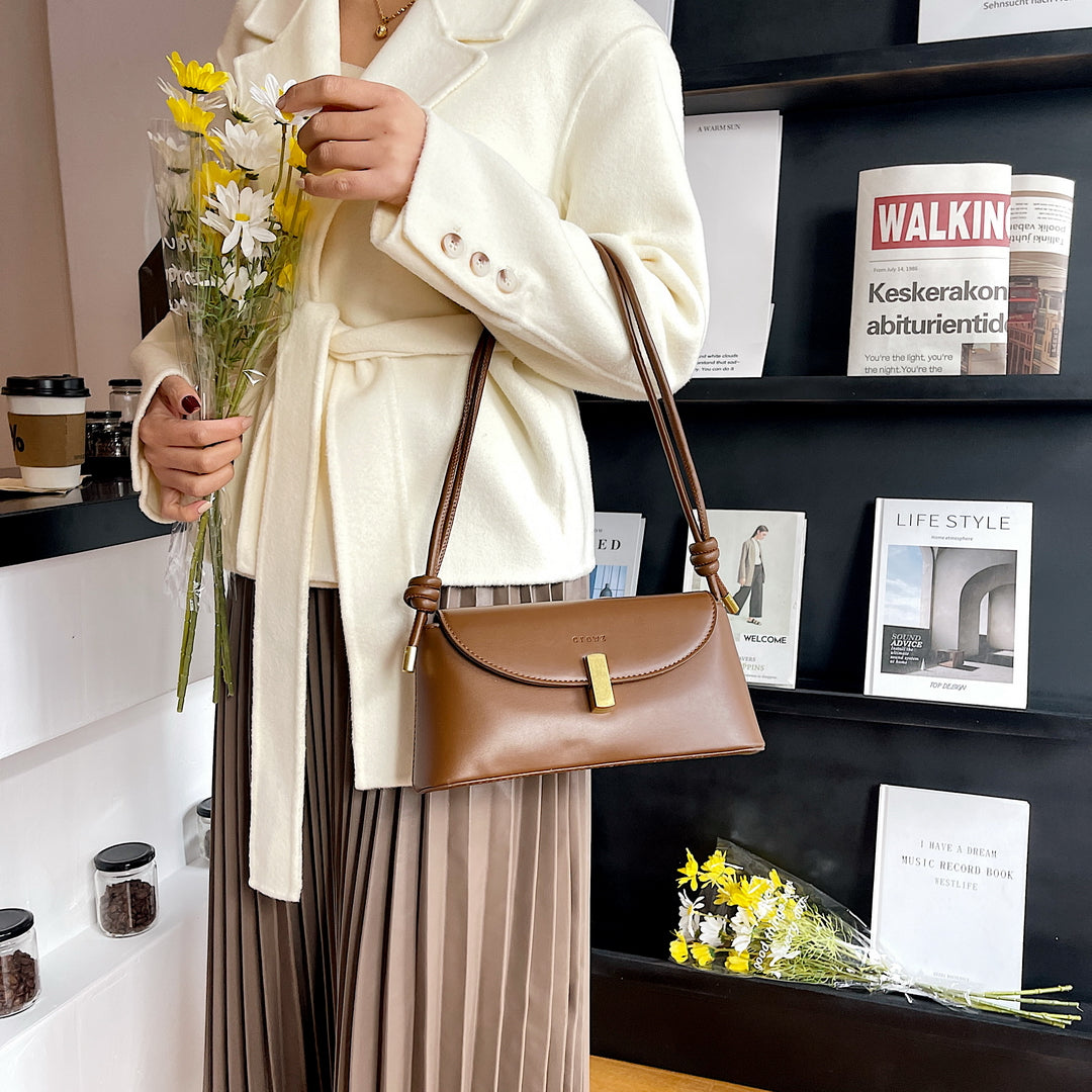 Metal clasp flap knotted strap PU leather shoulder bag