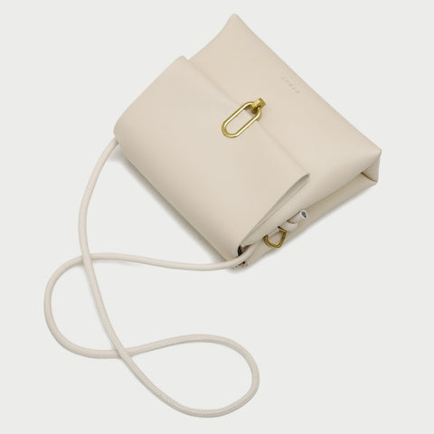 Oval hoop metallic closure dual compartment PU leather bag