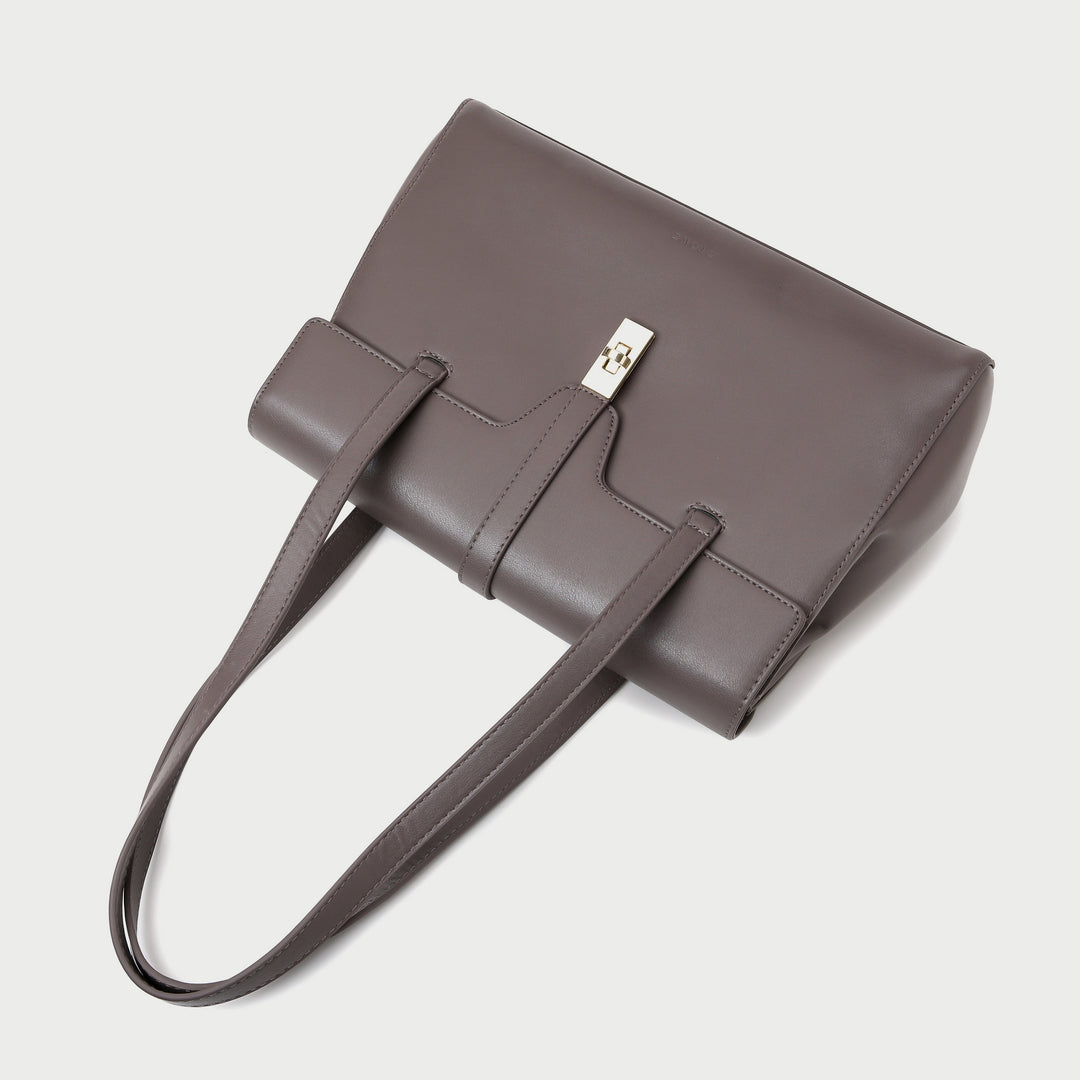 Strapped turn-lock flap two-compartment PU leather tote bag